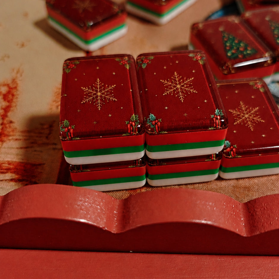 Close-up detail of festive American Mahjong tile backs in the BamChive Christmas Magic collection