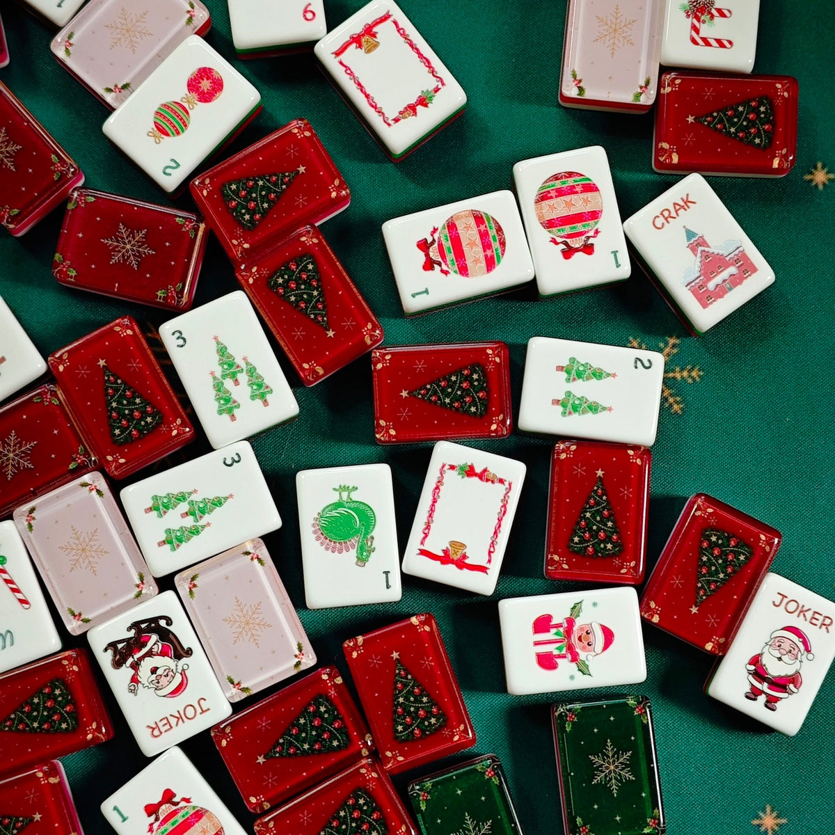 Close-up of festive tile faces and tile backs from the BamChive Christmas Magic American Mahjong set