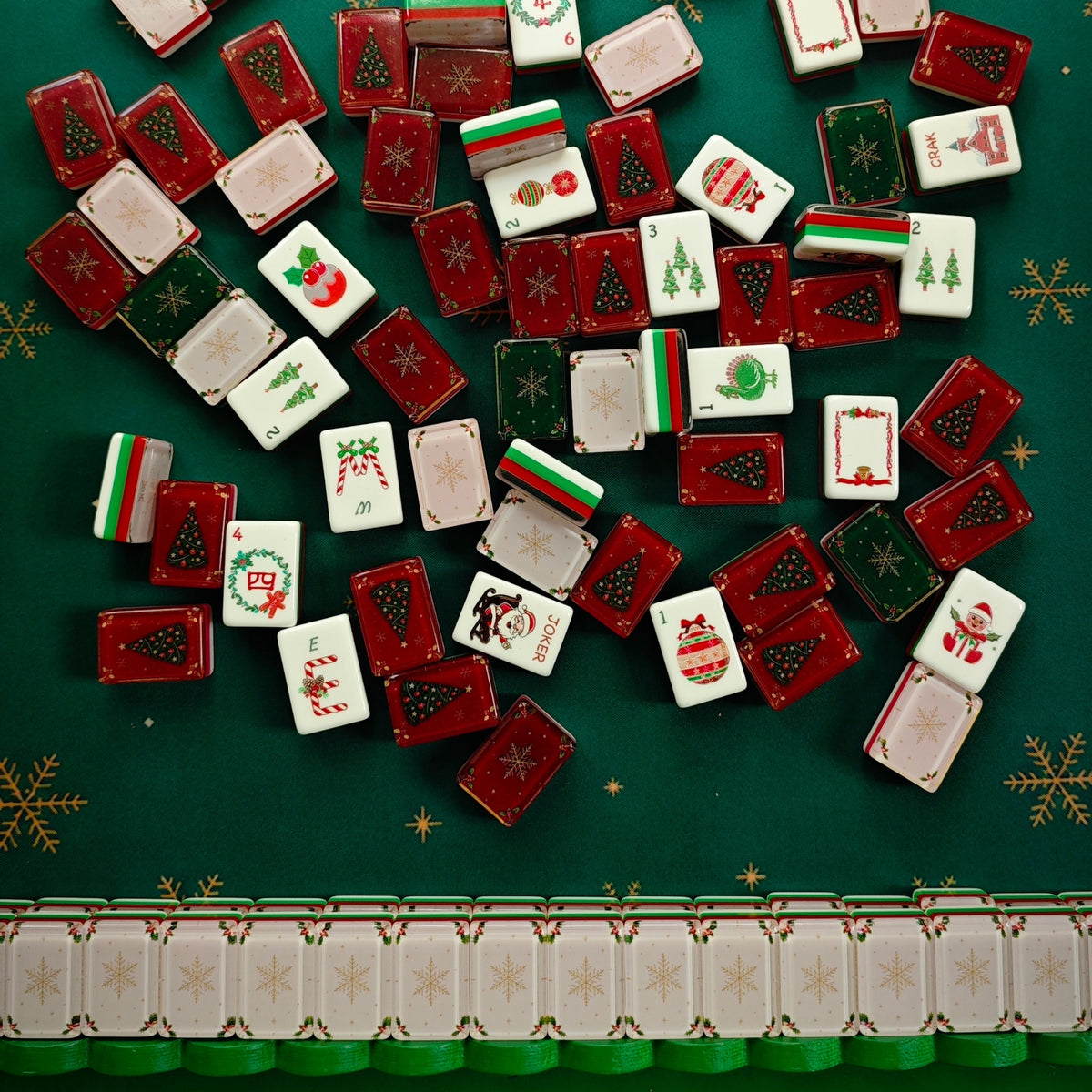 BamChive Christmas Magic 160-tile American Mahjong set in four holiday styles arranged on a green game mat