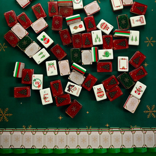 BamChive Christmas Magic 160-tile American Mahjong set in four holiday styles arranged on a green game mat