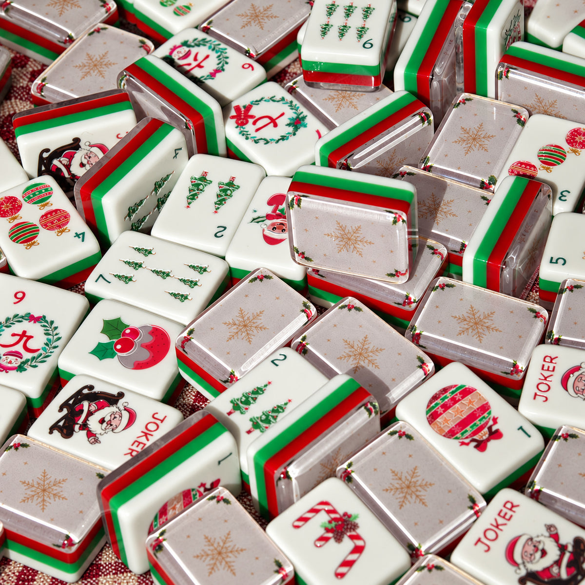 Close-up of BamChive Cream Christmas Star mahjong tiles showing gold snowflake backs, holiday tile faces, and layered edges.