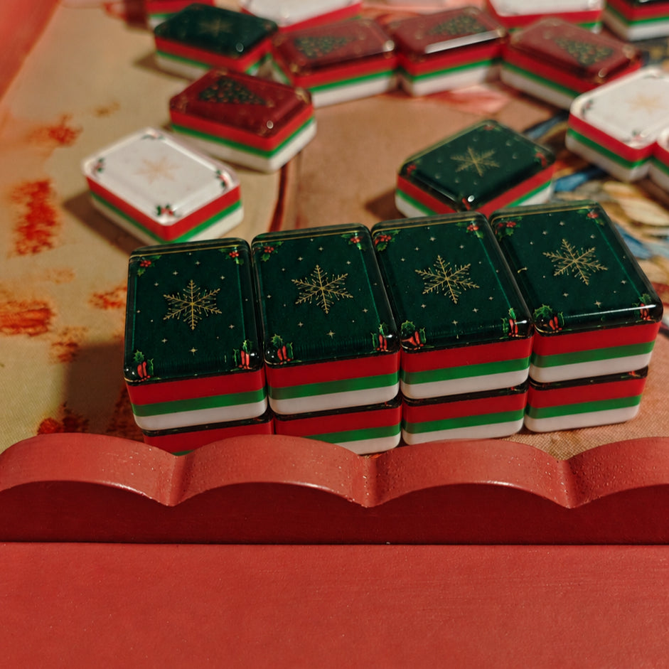 Close-up of Green Christmas Star tile backs in the BamChive Christmas Magic American Mahjong set