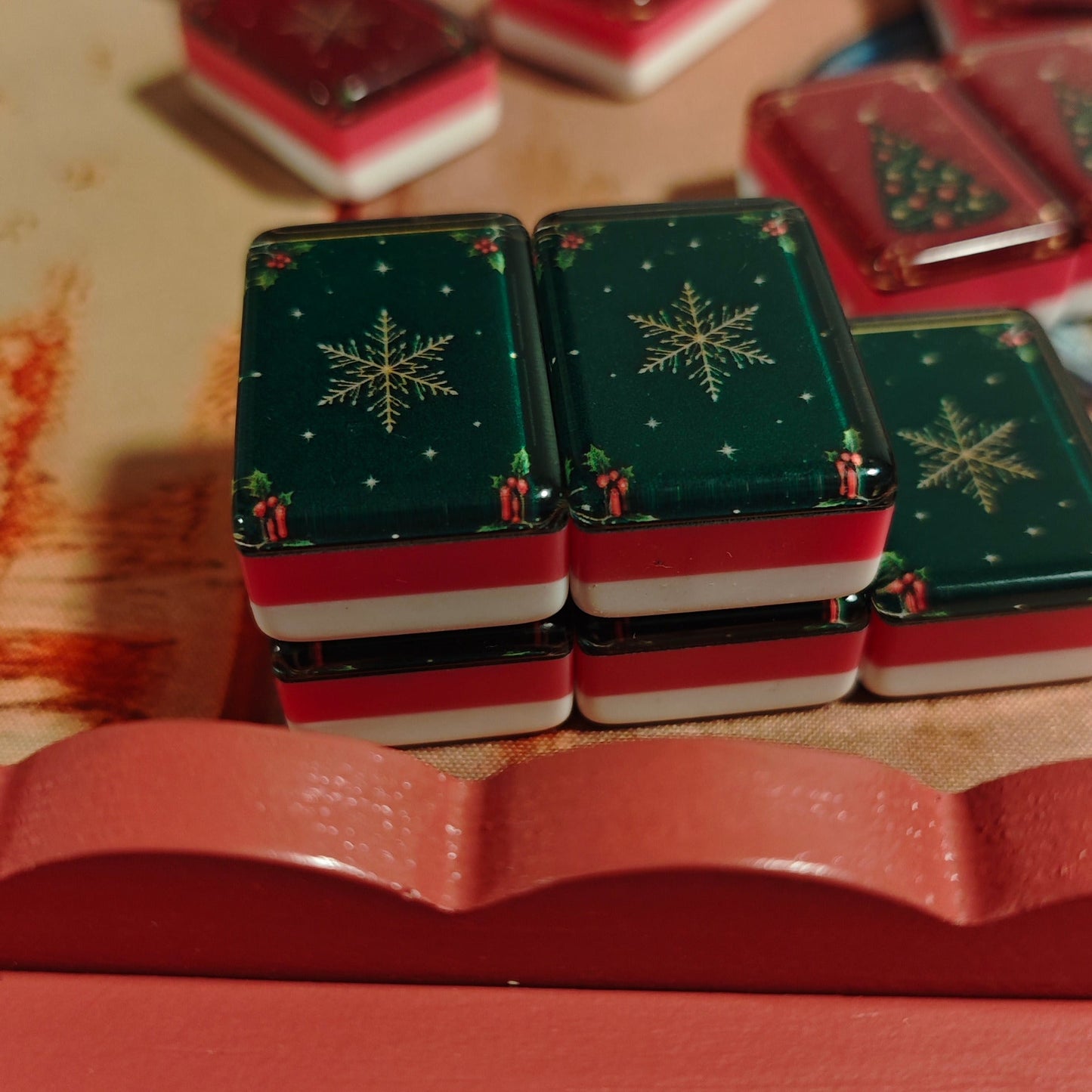 Close-up of green snowflake backs on BamChive Green Christmas Star American Mahjong tiles