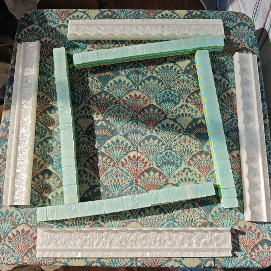 Four BamChive pearlescent magnetic acrylic mahjong racks and pushers arranged for American Mahjong play with display tiles